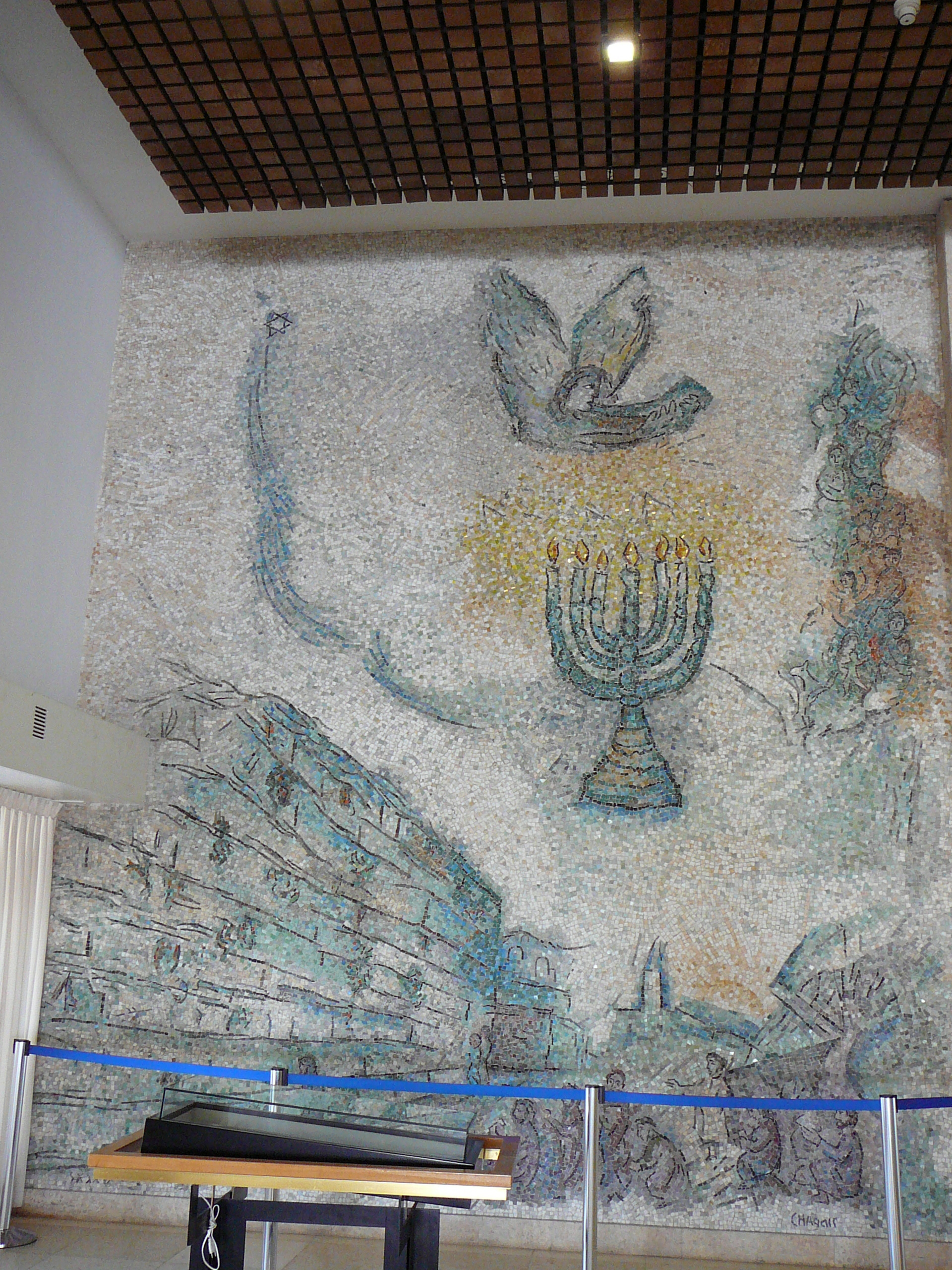 Chagall's interpretation of the Wailing Wall as a great mosaic performed by Italian artists. In the middle appears the angel of salvation, which calls the Jewish people home from the diaspora
